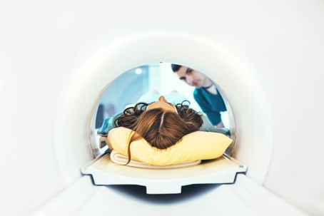 Woman with brain injury in an MRI tube